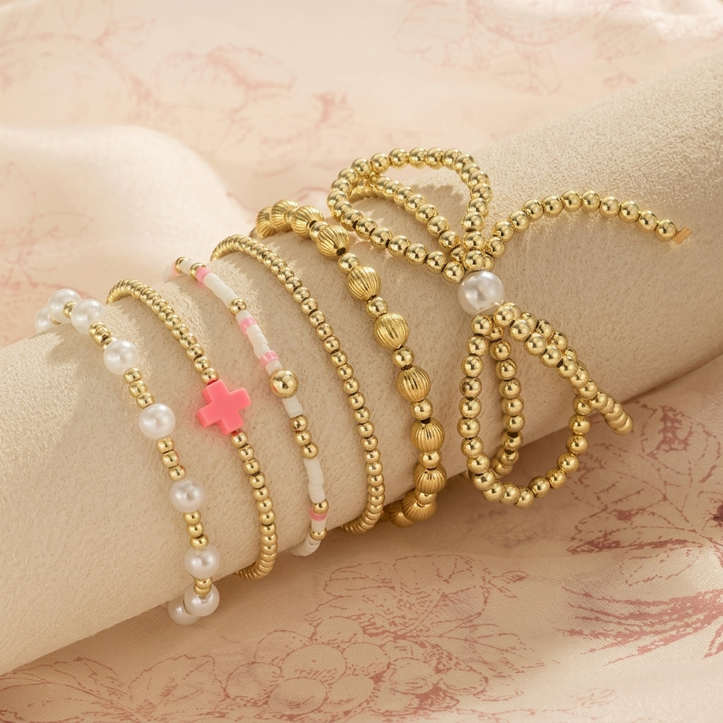 6pc Pink Accented Bow Gold Beaded Bracelet Stack