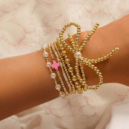 6pc Pink Accented Bow Gold Beaded Bracelet Stack