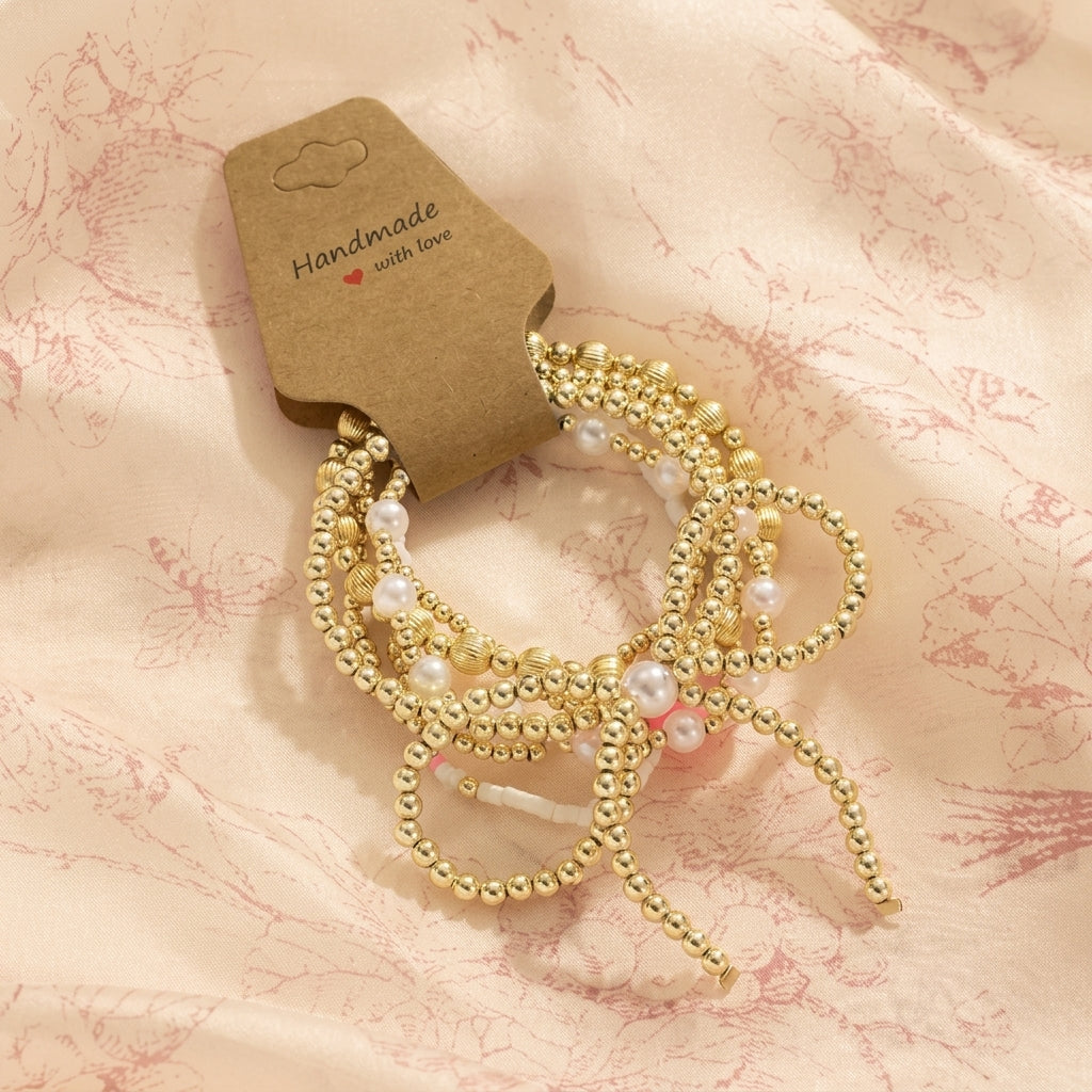 6pc Pink Accented Bow Gold Beaded Bracelet Stack
